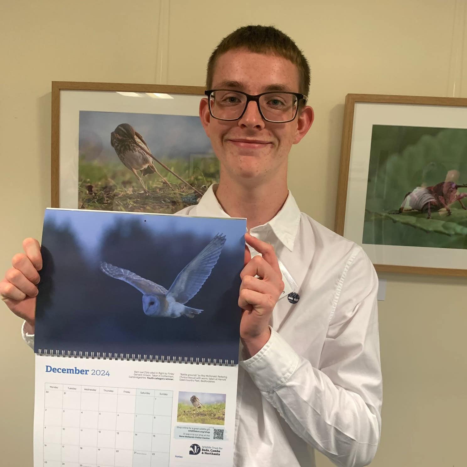 Reaseheath Wildlife Conservation and Ecology student Finley Gerrard Croxon with the Wildlife Trust for Bedfordshire, Cambridgeshire and Northamptonshire’s 2024 calendar, featuring his winning photograph in the Youth category of its 2023 photography competition.