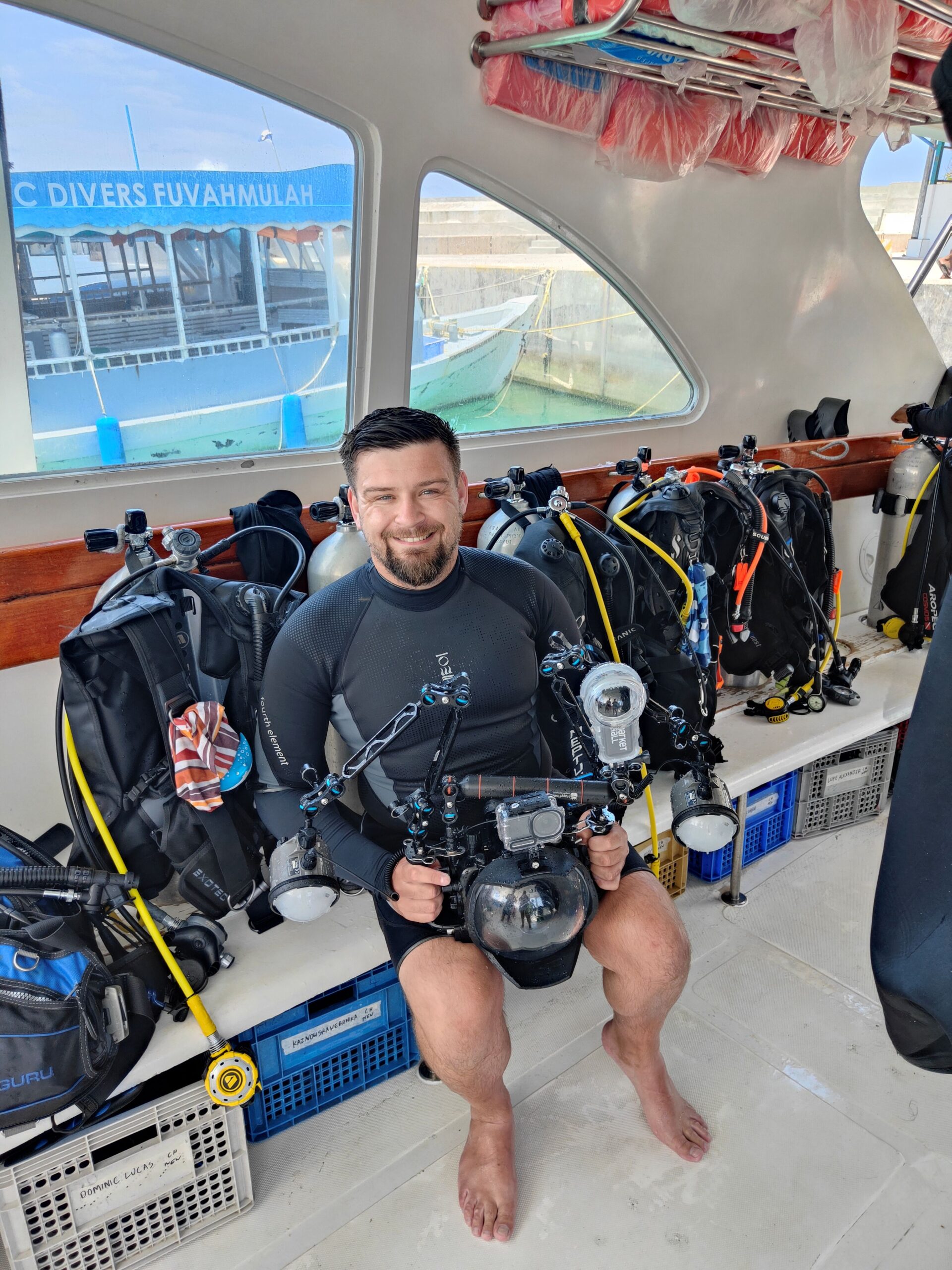 Reaseheath lecturer Donovan Lewis sitting on a boat after a dive in the Maldives
