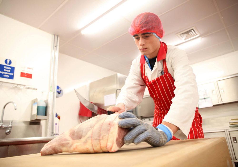 Butchery apprentice Lewis Gilray preparing lamb reared at Reaseheath Farm as part of the Field to Fork project.