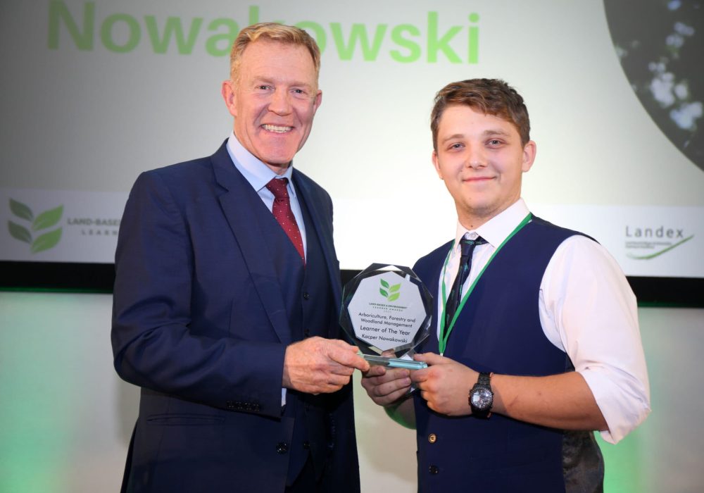 Reaseheath College student Kacper Nowakowski with Adam Henson at Land-based and environment learner awards 2023